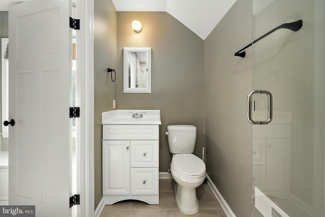 bathroom featuring vanity, lofted ceiling, tile patterned floors, toilet, and walk in shower