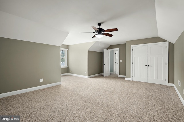 bonus room featuring ceiling fan, carpet floors, and lofted ceiling