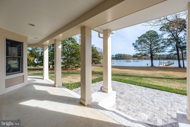 view of patio with a water view