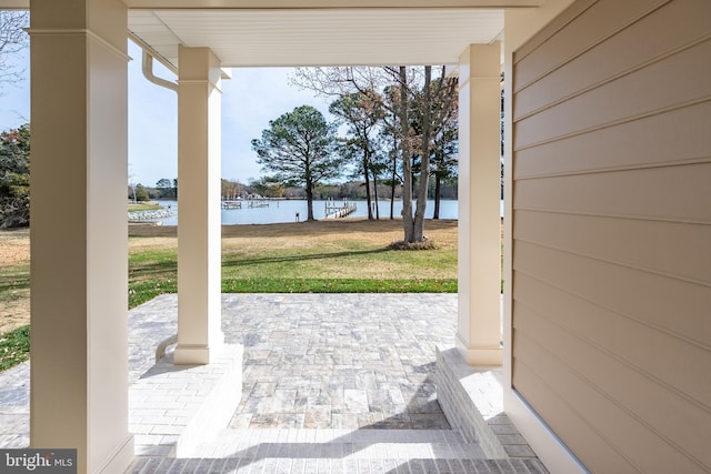 view of patio / terrace with a water view