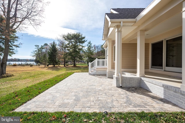 view of patio / terrace with a water view