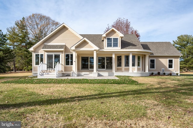 back of house featuring a yard