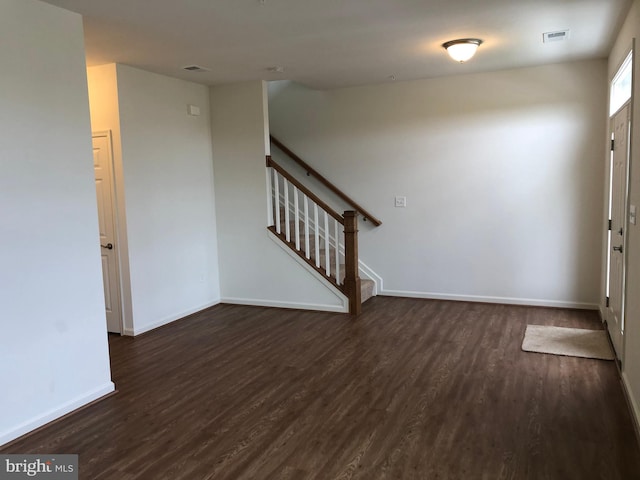 foyer with dark wood-type flooring