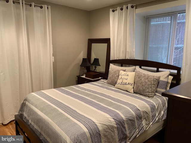 bedroom with hardwood / wood-style floors