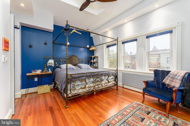 bedroom with hardwood / wood-style flooring and ceiling fan