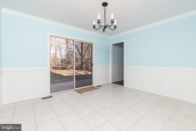 unfurnished dining area with crown molding and an inviting chandelier