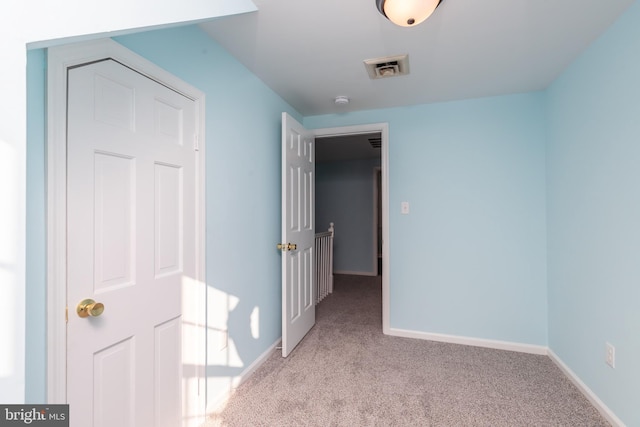 interior space featuring light colored carpet