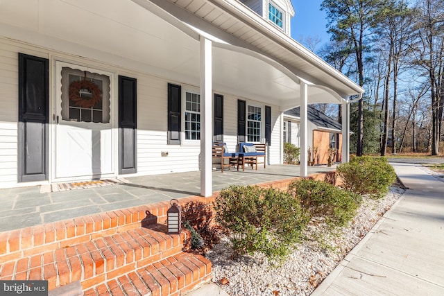 doorway to property featuring covered porch