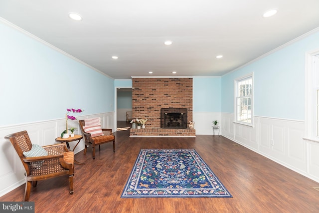 living room featuring ornamental molding and dark wood-type flooring