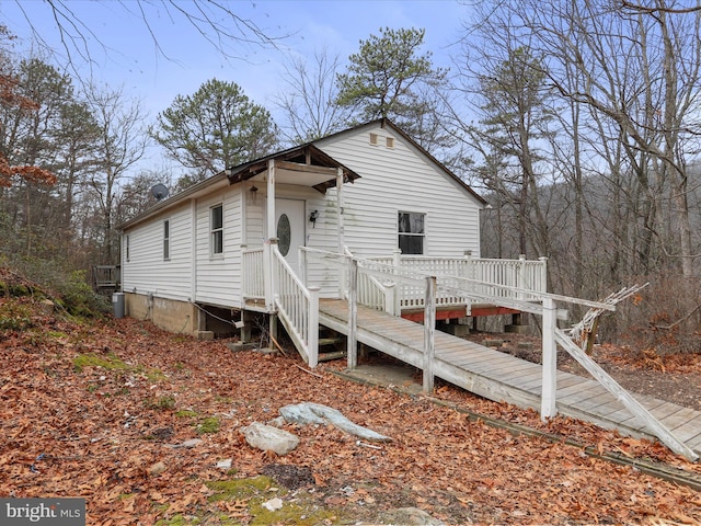 view of front of property with a wooden deck