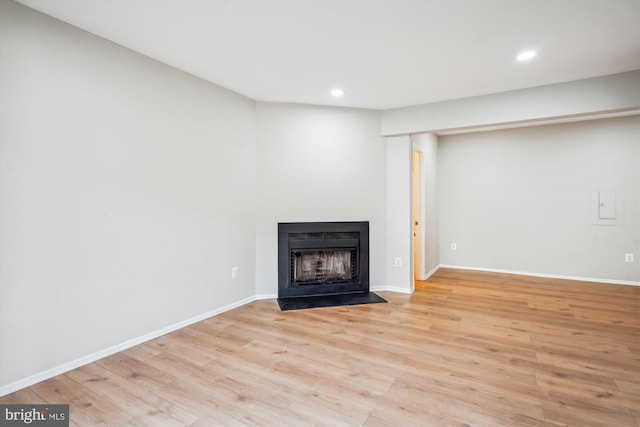 unfurnished living room with light wood-type flooring