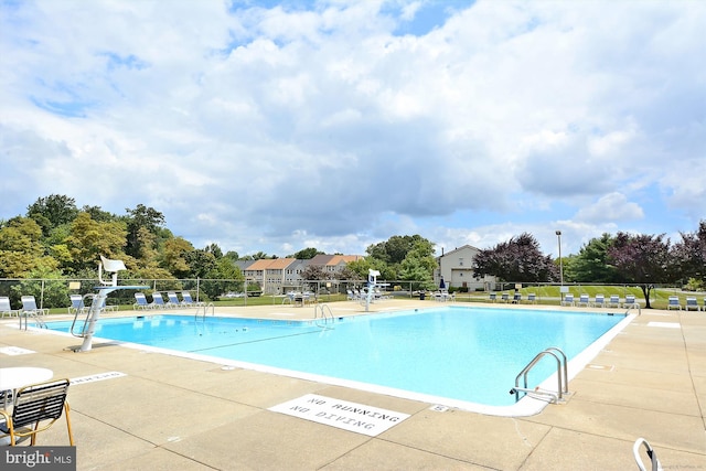 view of swimming pool with a patio area