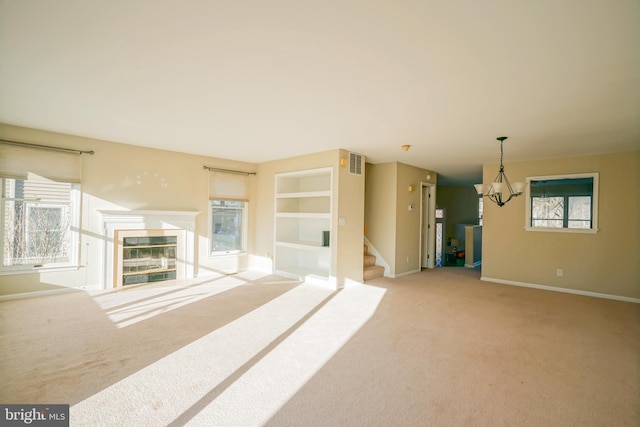 unfurnished living room with plenty of natural light and light carpet