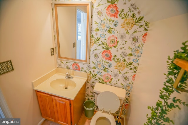 bathroom with vanity and toilet