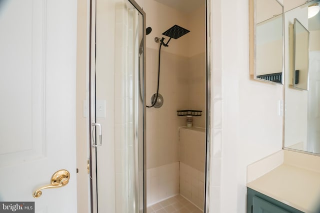 bathroom featuring tile patterned flooring and an enclosed shower