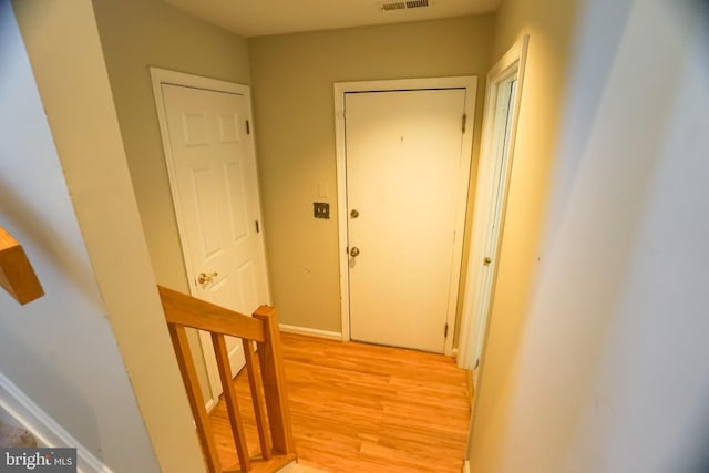 corridor featuring light hardwood / wood-style flooring