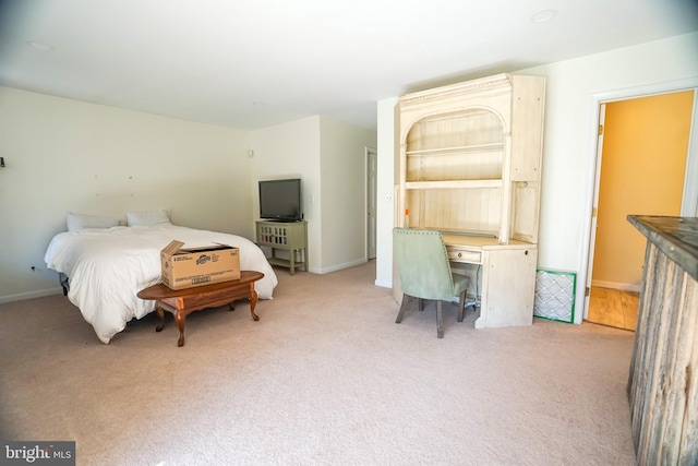 bedroom with light colored carpet