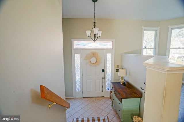 entrance foyer featuring a chandelier