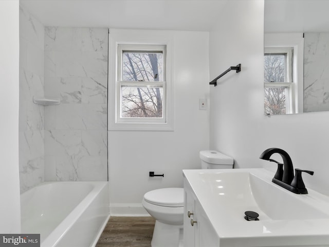 full bathroom featuring shower / washtub combination, toilet, vanity, and hardwood / wood-style flooring