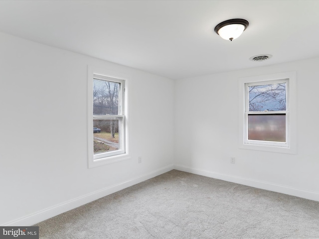 unfurnished room with carpet