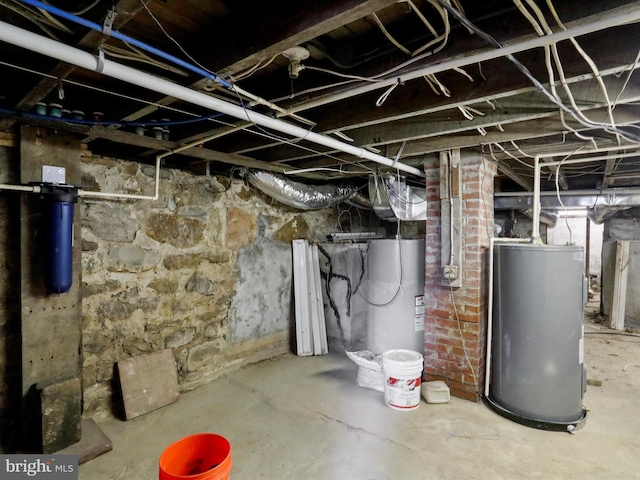 basement featuring gas water heater and water heater