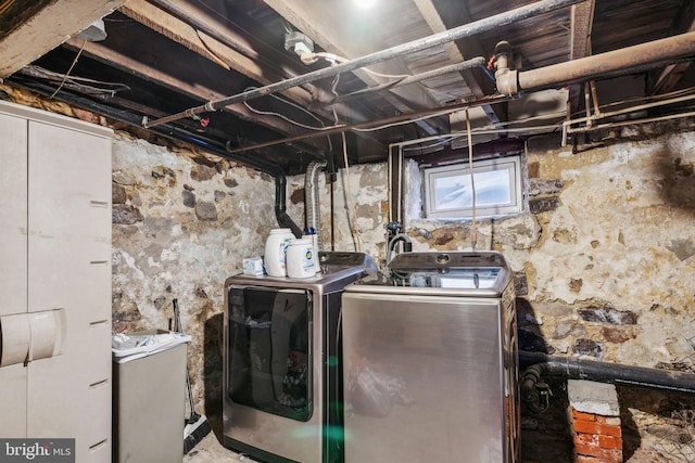 laundry area with washing machine and dryer