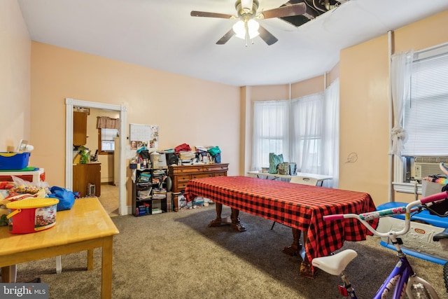 rec room with carpet flooring, ceiling fan, and cooling unit