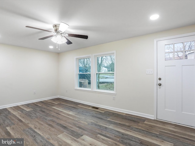 entrance foyer with dark hardwood / wood-style flooring and ceiling fan