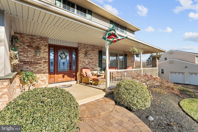 view of exterior entry with covered porch