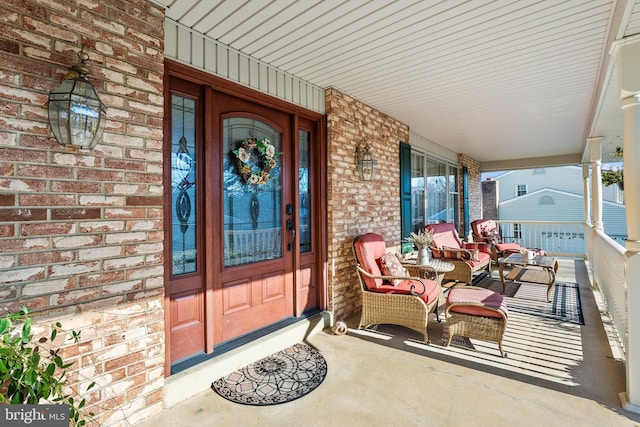 doorway to property with covered porch