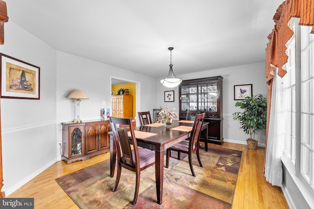 dining area with light wood-type flooring