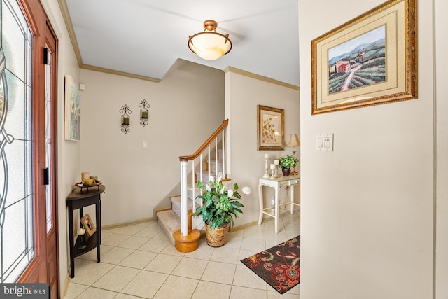 entryway featuring light tile patterned floors and crown molding