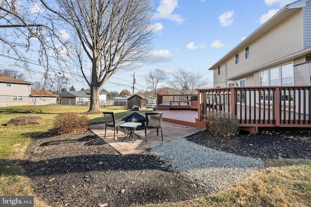 view of yard with a patio area and a deck