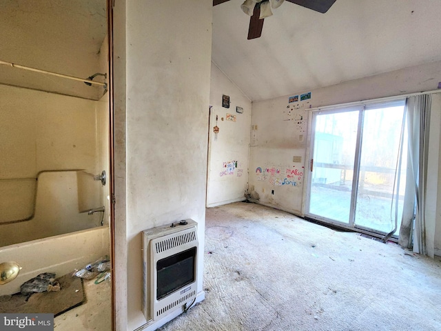 interior space featuring ceiling fan, lofted ceiling, and heating unit