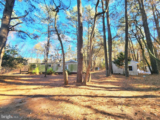 view of front of property with an outdoor structure