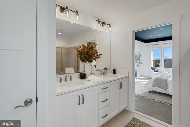 bathroom with vanity and walk in shower