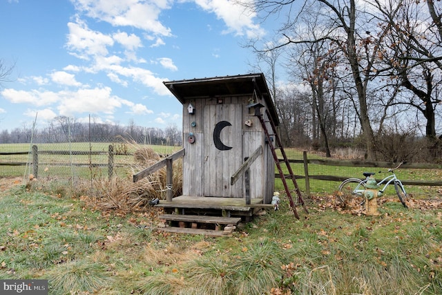 view of outdoor structure featuring a rural view