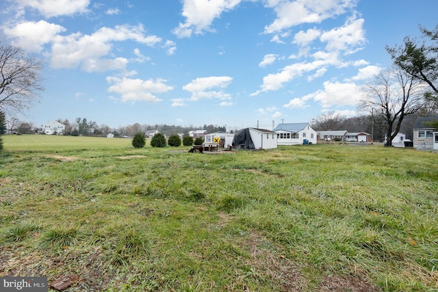 view of yard with a rural view