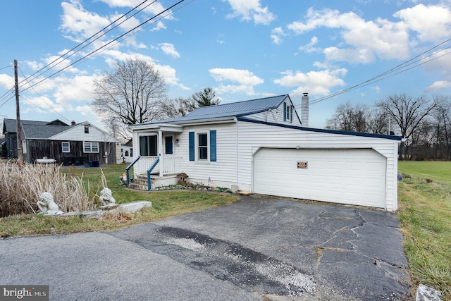 view of front facade with a front lawn and a garage