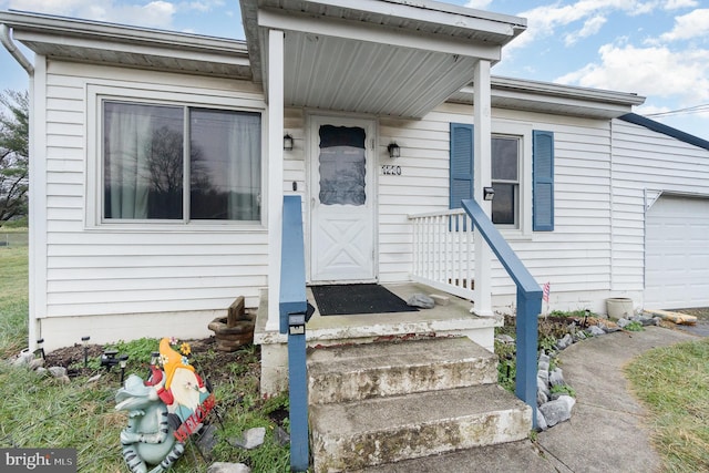 doorway to property featuring a garage