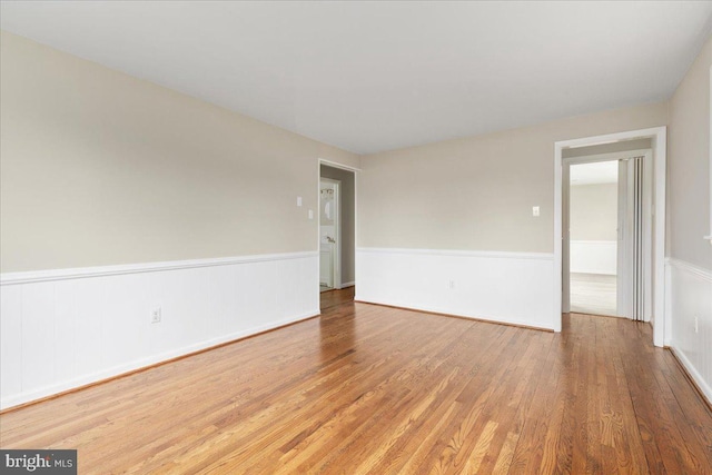 spare room with hardwood / wood-style floors