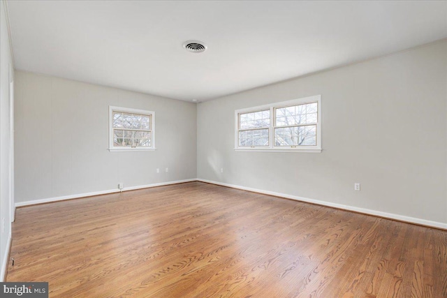 spare room with light hardwood / wood-style floors