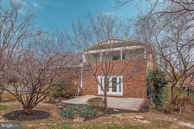 back of house with a patio area and french doors