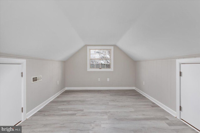 bonus room featuring light hardwood / wood-style floors and lofted ceiling