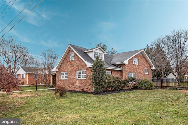 view of side of home with a lawn