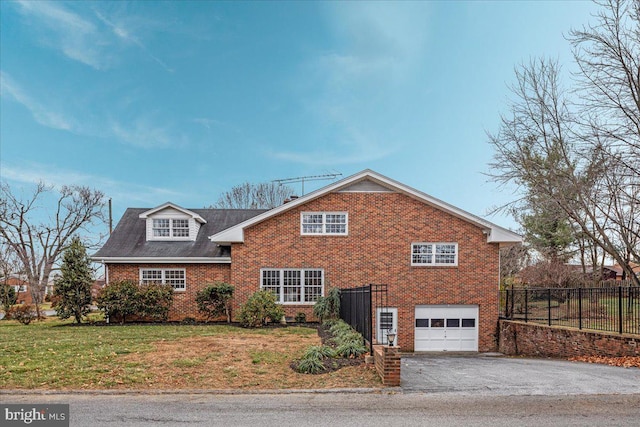 front of property featuring a garage and a front lawn