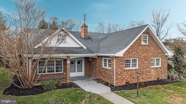 view of front of home featuring french doors and a front lawn