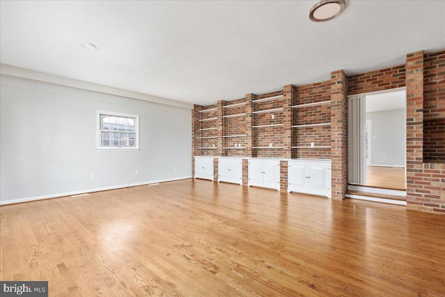 unfurnished living room featuring light hardwood / wood-style floors