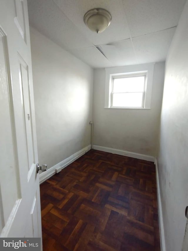 empty room with dark parquet floors