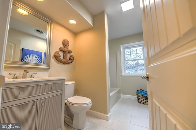 bathroom with vanity, tile patterned floors, and toilet